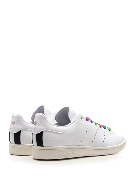 Iconic adidas Stan Smith sneaker reinterpreted by Stella McCartney, for the  first time in a vegan version. Made with recycled polyester and renewed  with Stella McCartney's portrait on the tongue, the most
