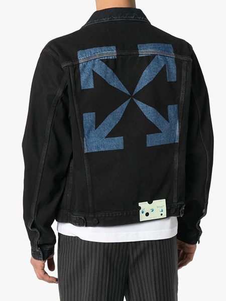 black denim jacket with design on the back