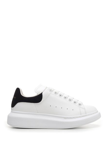 white sneakers with black heel