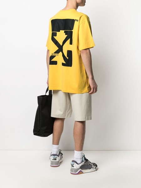 white top yellow sleeves