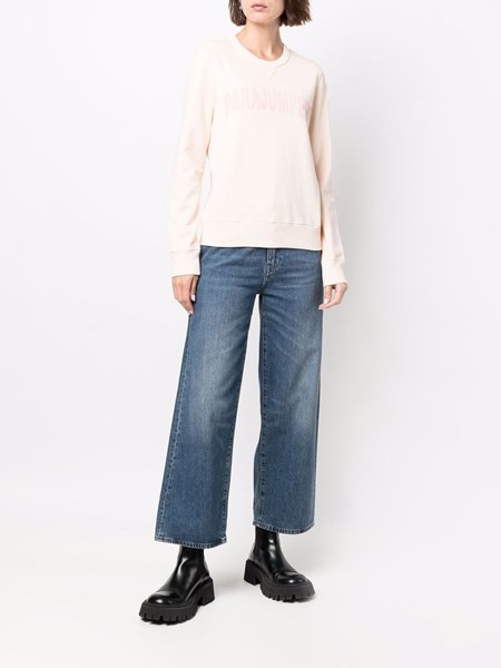 peach colored sweatshirt